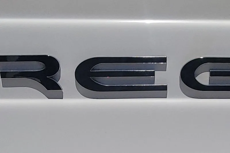 Slide: The Image of Chrome "Regal" emblem on a 2005 Commodore 2860 boat. - 30