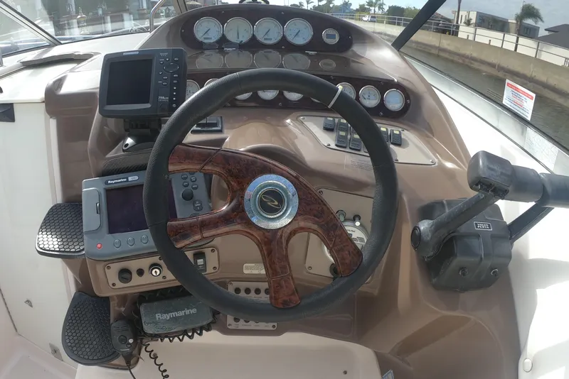 Slide: The Image of Steering console of 2005 Regal Commodore 2860 boat with navigation instruments and controls. - 6