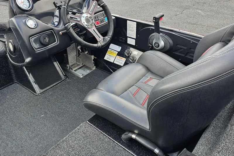 Slide: The Image of Interior of a 2017 Nitro Z20 Pro boat featuring steering wheel and control panel. - 10