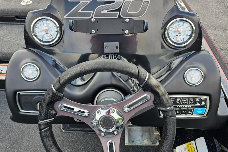 Slide: The Image of Steering console of a 2017 Nitro Z20 Pro boat with gauges and controls. - 11