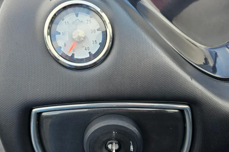 Slide: The Image of Dashboard of a 2017 Nitro Z20 Pro with a speedometer and ignition key slot. - 16