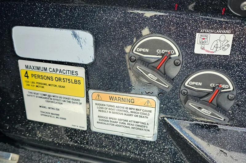 Slide: The Image of Boat control panel with capacity warning labels and open/closed switches, Nitro Z20 Pro 2017 model. - 19