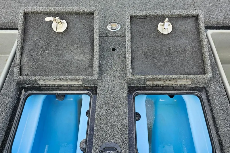 Slide: The Image of Nitro Z20 Pro 2017 boat livewell compartments with blue interior and secure latches. - 34