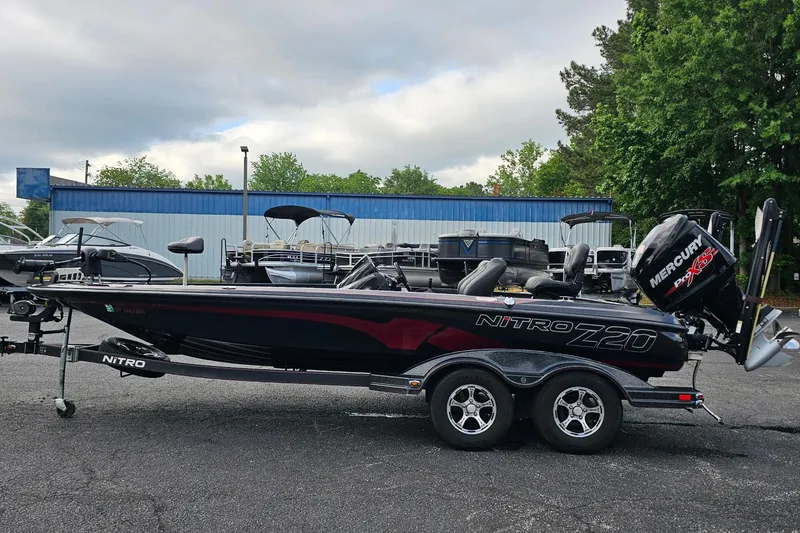 Slide: The Image of 2017 Nitro Z20 Pro bass boat with Mercury engine, parked outdoors. - 41