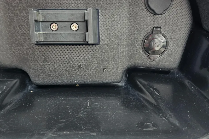 Slide: The Image of 2019 Yamaha Boats AR195 dashboard with 12V marine power outlet and mounting bracket. - 10