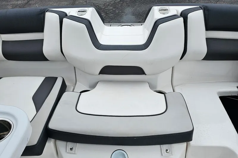 Slide: The Image of 2019 Yamaha Boats AR195 interior seating with sleek black and white design. - 19