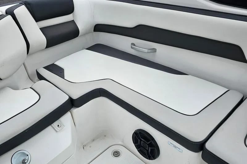 Slide: The Image of Interior seating of a 2019 Yamaha Boats AR195, featuring sleek black and white upholstery. - 20