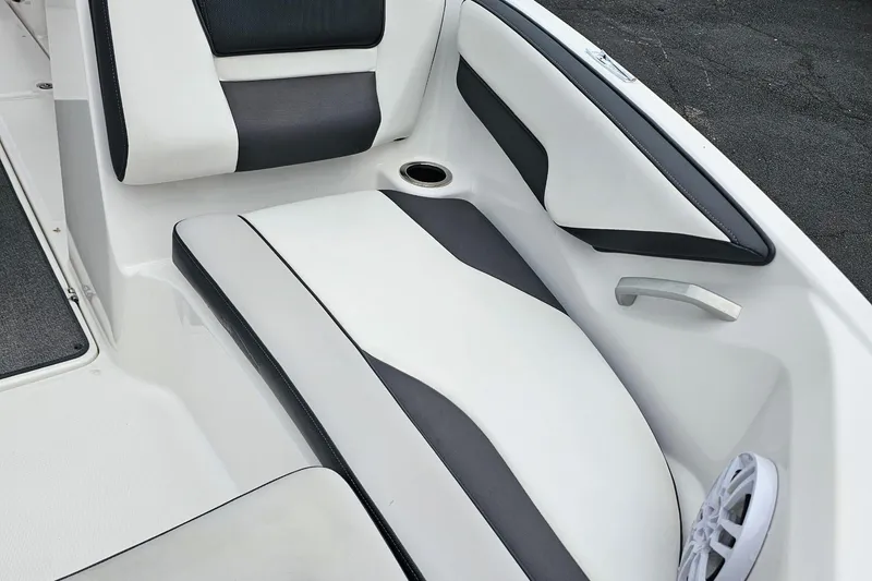 Slide: The Image of 2019 Yamaha Boats AR195 interior seating with sleek black and white design. - 27