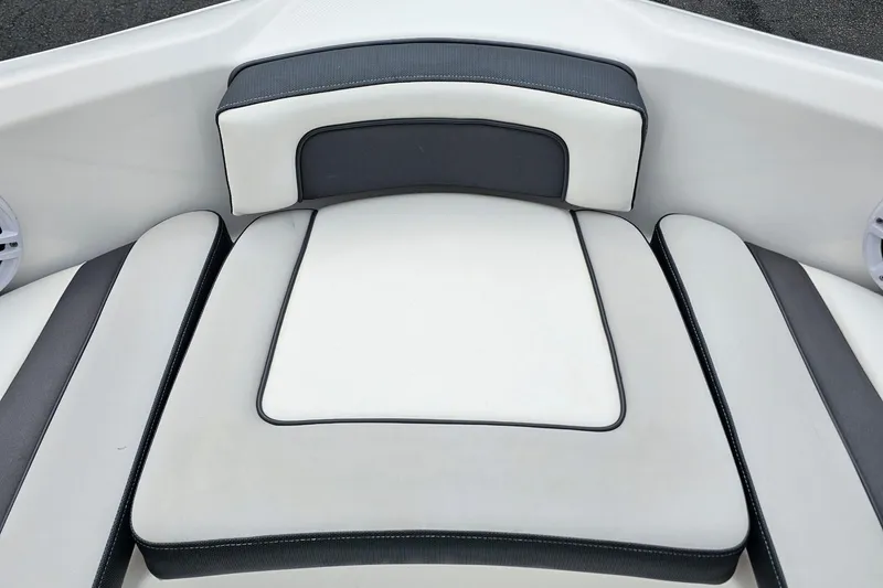 Slide: The Image of 2019 Yamaha Boats AR195 interior seating, featuring sleek white and gray upholstery. - 28