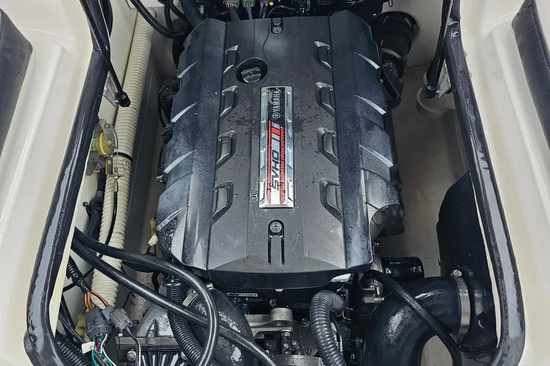 Slide: The Image of 2019 Yamaha Boats AR195 engine compartment with visible components and wiring. - 30