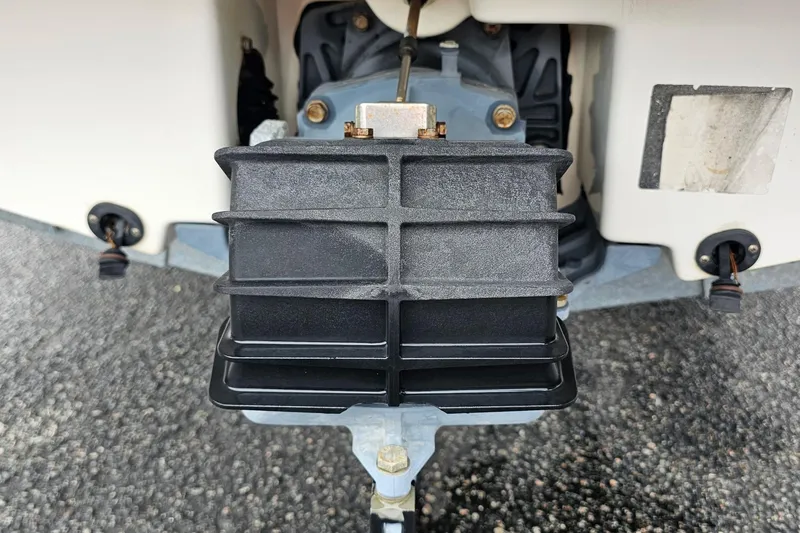 Slide: The Image of Close-up of 2019 Yamaha AR195 boat engine component on asphalt surface. - 31