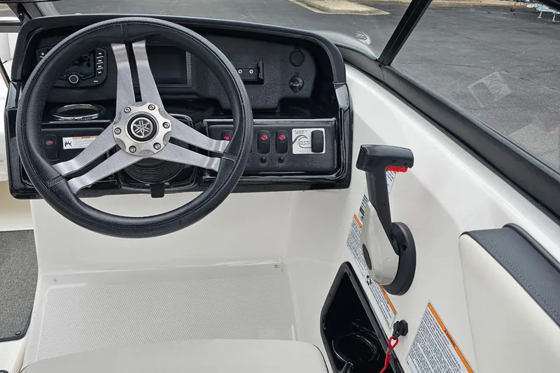 Slide: The Image of 2019 Yamaha Boats AR195 steering wheel and control panel, featuring sleek design and functionality. - 7