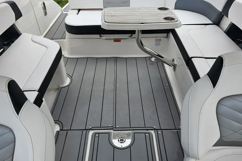 Slide: The Image of Interior of 2021 Chaparral 307 SSX boat with seating and table setup. - 14