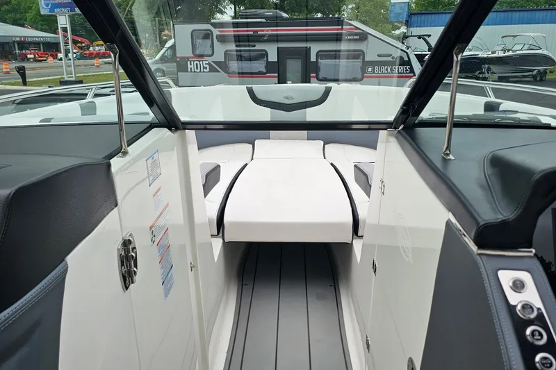 Slide: The Image of Interior view of 2021 Chaparral 307 SSX boat, featuring sleek seating and modern design. - 23