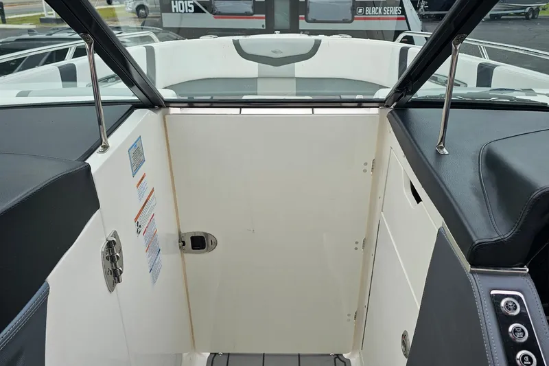 Slide: The Image of Interior view of a 2021 Chaparral 307 SSX boat, featuring sleek seating and control panel. - 24