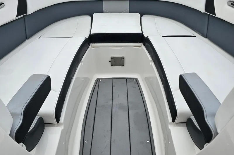 Slide: The Image of 2021 Chaparral 307 SSX boat interior with sleek seating and modern design. - 28