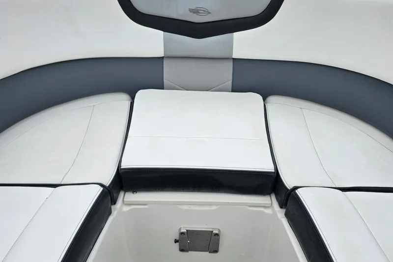 Slide: The Image of Interior seating of 2021 Chaparral 307 SSX boat, featuring sleek white and gray upholstery. - 30