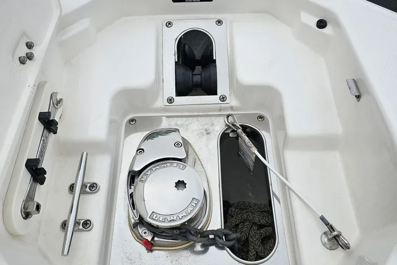 Slide: The Image of 2021 Chaparral 307 SSX boat anchor compartment with Lewmar windlass system. - 32