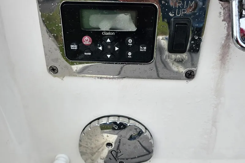 Slide: The Image of Control panel of a 2021 Chaparral 307 SSX boat with Clarion audio system. - 39