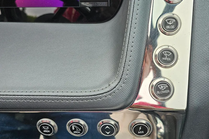 Slide: The Image of Control panel of a 2021 Chaparral 307 SSX boat with various function buttons. - 9