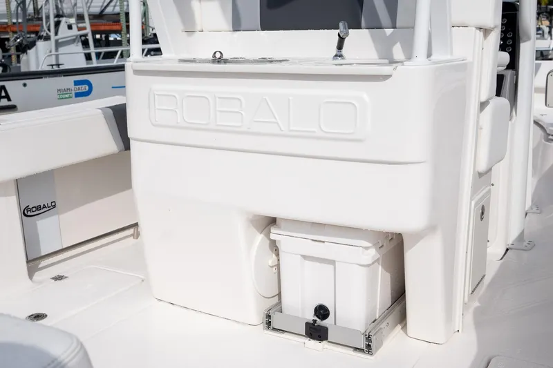 Slide: The Image of 2025 Robalo R270 Center Console boat interior with storage and sink. - 8