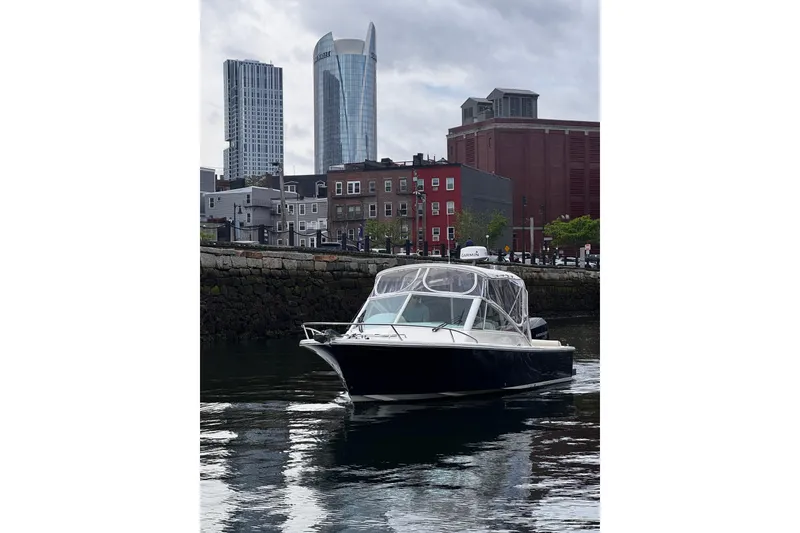The Image of 2020 Hunt Yachts Harrier 26 cruising in urban waterfront setting. - 1
