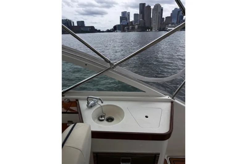 Slide: The Image of 2020 Hunt Yachts Harrier 26 interior with sink, city skyline view. - 13