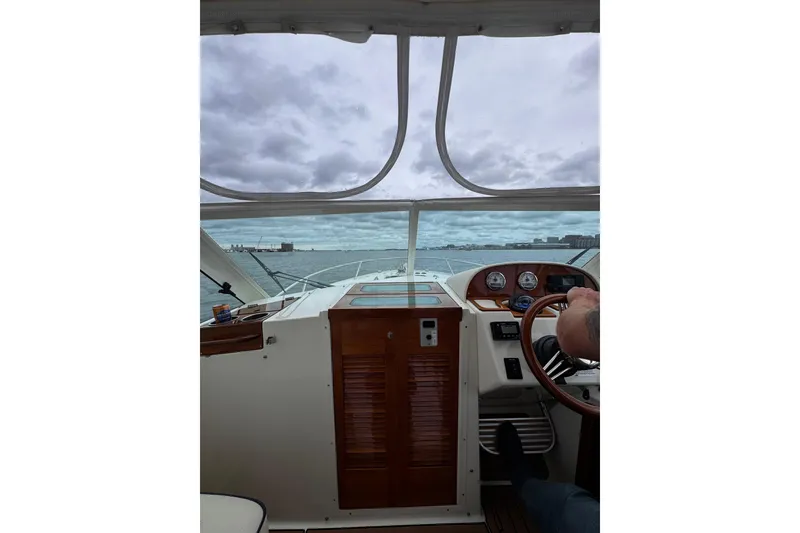 Slide: The Image of Interior view of 2020 Hunt Yachts Harrier 26, showcasing helm and dashboard controls. - 15