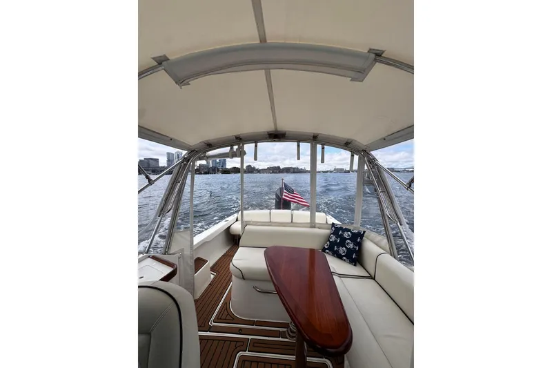 Slide: The Image of Interior view of 2020 Hunt Yachts Harrier 26, featuring elegant seating and scenic water backdrop. - 16