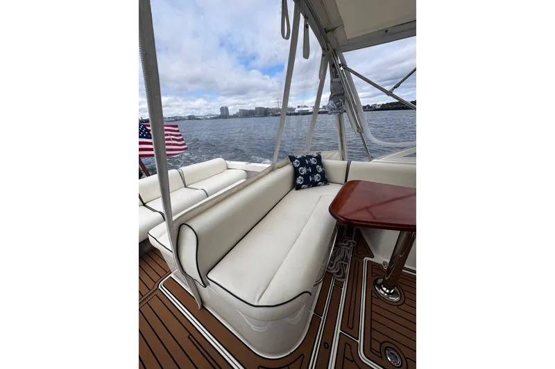 Slide: The Image of Luxurious 2020 Hunt Yachts Harrier 26 interior with elegant seating and scenic water view. - 17