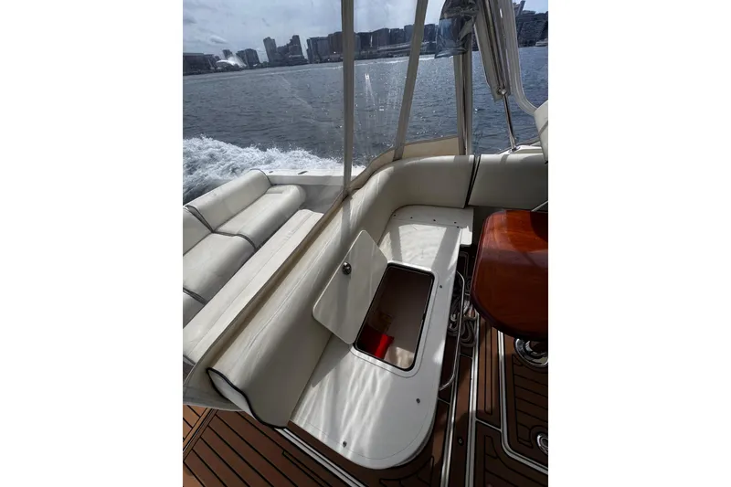 Slide: The Image of Interior view of 2020 Hunt Yachts Harrier 26, featuring elegant seating and wooden flooring. - 26