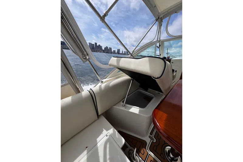 Slide: The Image of 2020 Hunt Yachts Harrier 26 interior with open storage, city skyline view. - 27