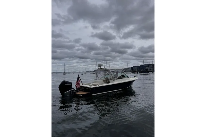 Slide: The Image of 2020 Hunt Yachts Harrier 26 on calm water under cloudy skies. - 3