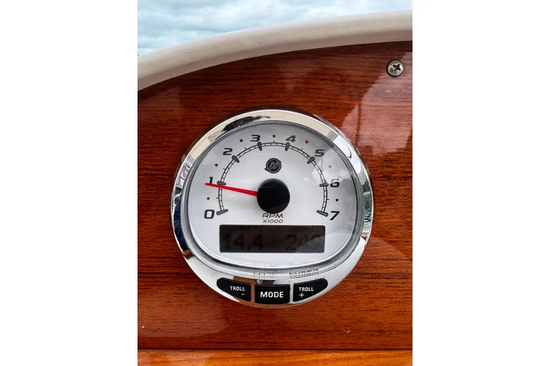Slide: The Image of Tachometer on 2020 Hunt Yachts Harrier 26, displaying RPM and hours on wooden dashboard. - 4