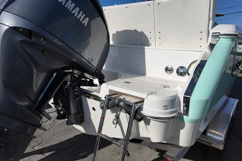 Slide: The Image of 2025 Robalo R232 Explorer boat with Yamaha outboard motor, rear view. - 17