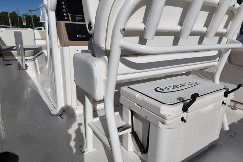 Slide: The Image of 2025 Robalo R232 Explorer boat interior with seating and storage cooler. - 5