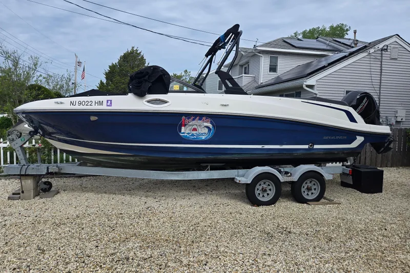The Image of 2020 Bayliner VR6 Bowrider OB on trailer, parked in residential area. - 0