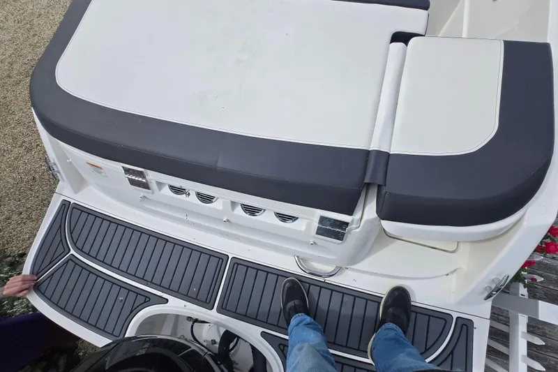 Slide: The Image of 2020 Bayliner VR6 Bowrider OB boat deck with cushioned seating and non-slip flooring. - 18