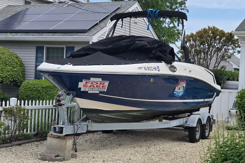 Slide: The Image of 2020 Bayliner VR6 Bowrider OB boat for sale on trailer, parked in driveway. - 25
