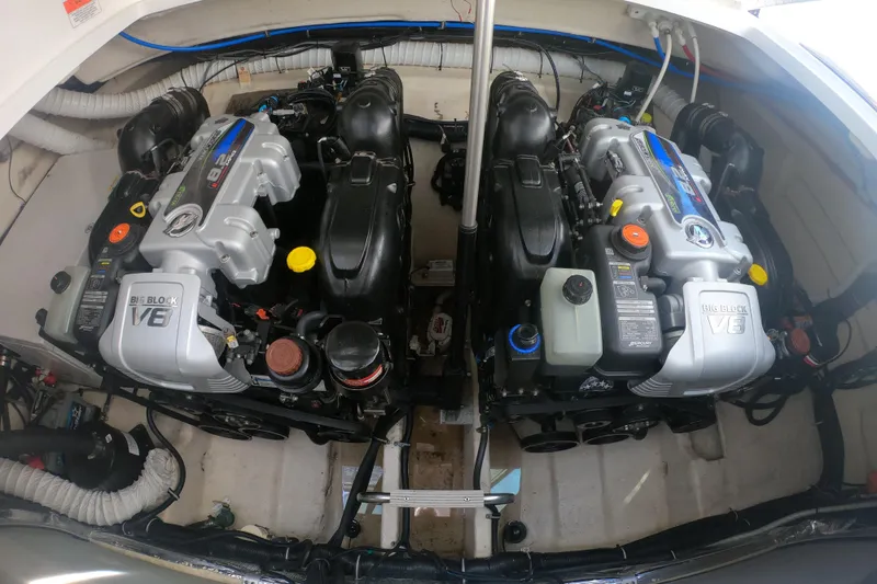 Slide: The Image of 2017 Rinker EX 370 yacht interior with seating and kitchenette at marina. - 16