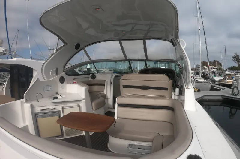 Slide: The Image of Interior of 2017 Rinker EX 370 yacht with cozy seating and nautical-themed decor. - 23
