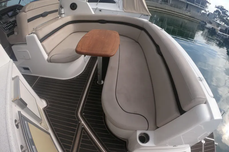 Slide: The Image of Interior of 2017 Rinker EX 370 yacht with cozy seating and wooden accents. - 24