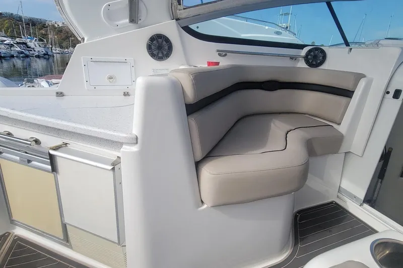 Slide: The Image of Cozy cabin interior of 2017 Rinker EX 370 with plush bedding and decorative pillows. - 25