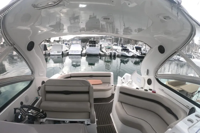 Slide: The Image of Interior of 2017 Rinker EX 370 yacht with cozy seating and nautical-themed pillows. - 26