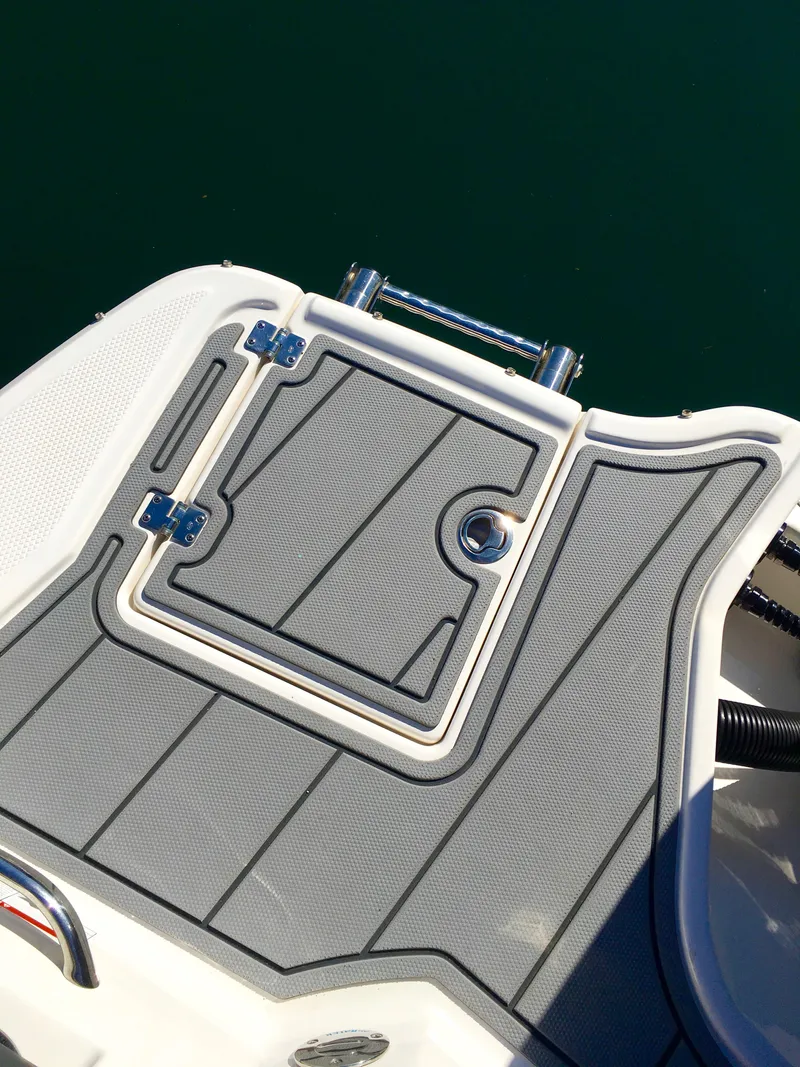 Slide: The Image of Rear view of 2022 Chaparral 230 SSi boat with gray deck. - 12