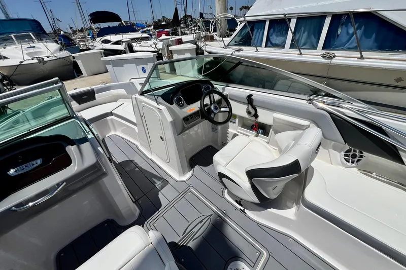 Slide: The Image of Interior view of a 2022 Chaparral 230 SSi boat at a marina. - 23