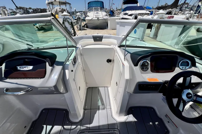 Slide: The Image of 2022 Chaparral 230 SSi boat interior with modern dashboard and steering wheel. - 35