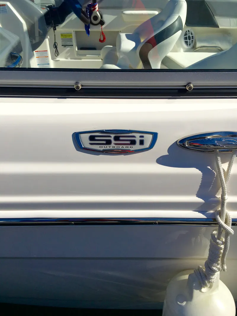 Slide: The Image of 2022 Chaparral 230 SSi boat with fender and logo. - 44