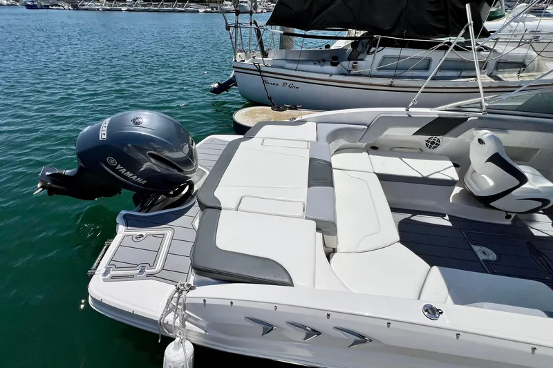 Slide: The Image of 2022 Chaparral 230 SSi boat with Yamaha outboard motor docked at marina. - 8