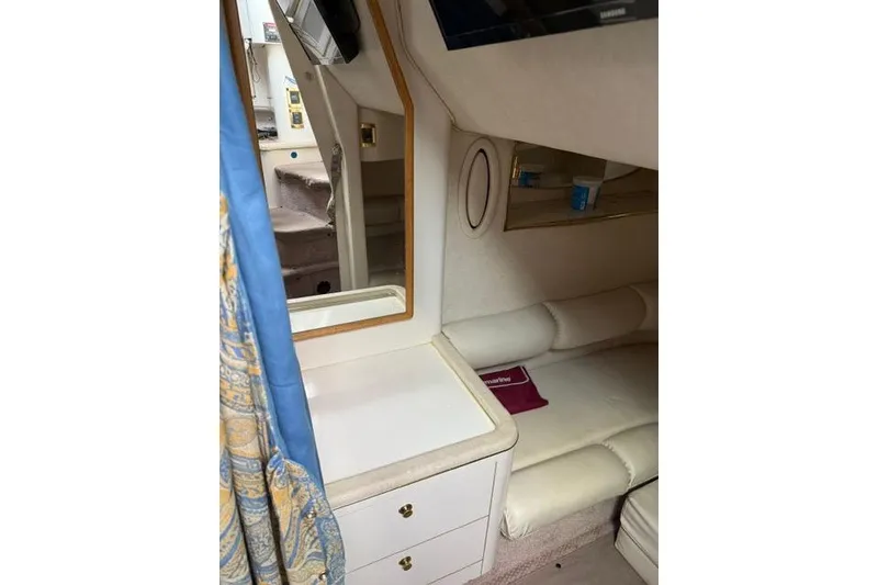 Slide: The Image of Interior of 1997 Sea Ray Sundancer 370 yacht with seating and storage. - 15
